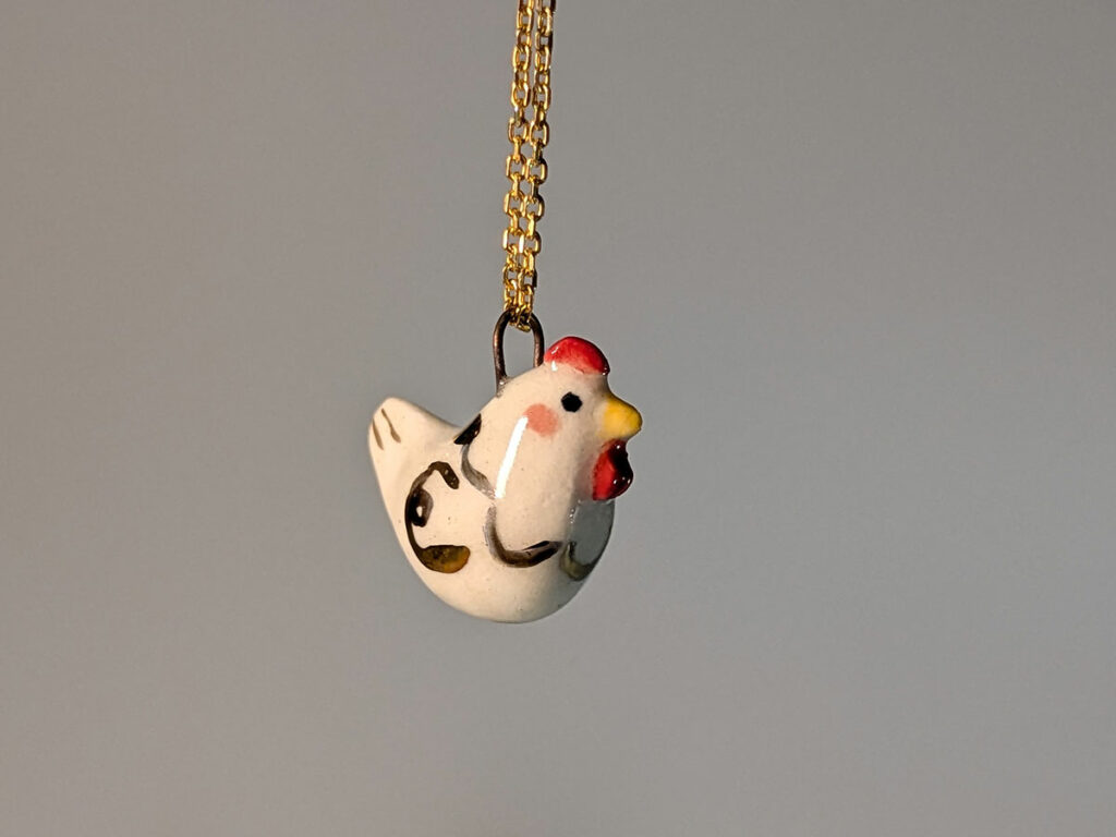 white hen porcelain pendant with gold