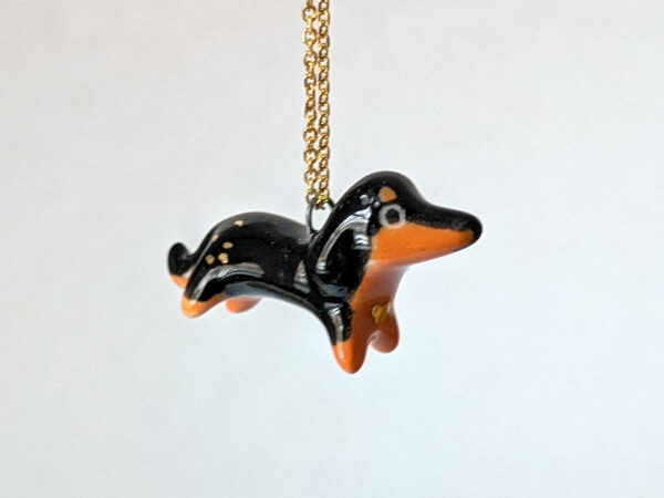 adorable dachshund porcelain pendant with gold, handmade