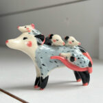 figurine opossum mama and babies