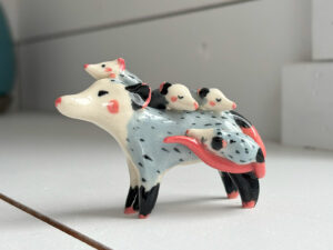 figurine opossum mama and babies