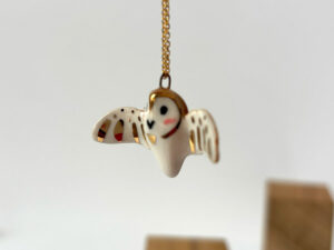 cute handmade porcelain barn owl pendant with wings out and gold