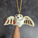 cute handmade porcelain barn owl pendant with wings out and gold