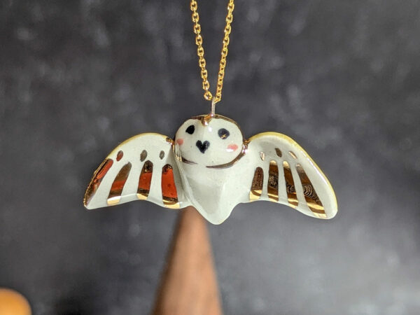 cute handmade porcelain barn owl pendant with wings out and gold