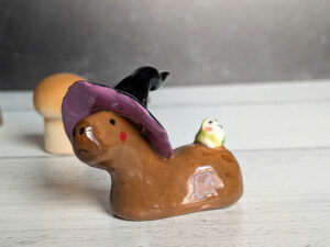 figurine capybara witch