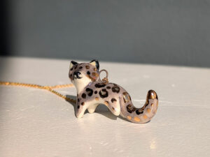 porcelain pendant snow leopard