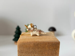 adorable triceratops pendant handmade with porcelain