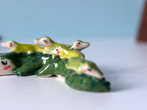 cute porcelain crocodile mama figurine and babies