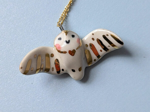 cute handmade porcelain barn owl pendant with wings out and gold