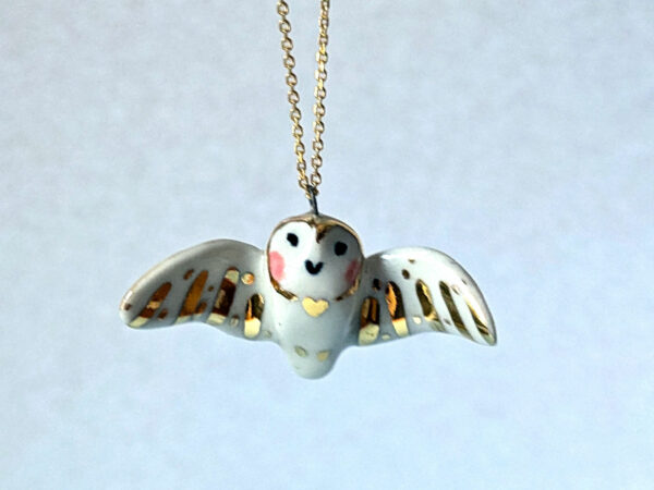 cute handmade porcelain barn owl pendant with wings out and gold