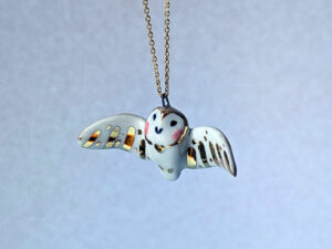 cute handmade porcelain barn owl pendant with wings out and gold