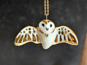 cute handmade porcelain barn owl pendant with wings out and gold