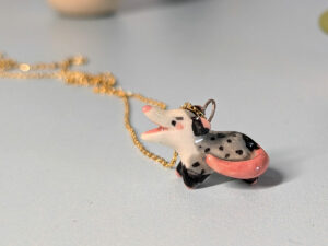 screaming opossum pendant