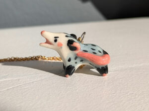 screaming opossum pendant