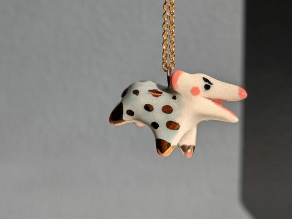 screaming opossum pendant