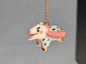 screaming opossum pendant