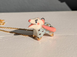 screaming opossum pendant