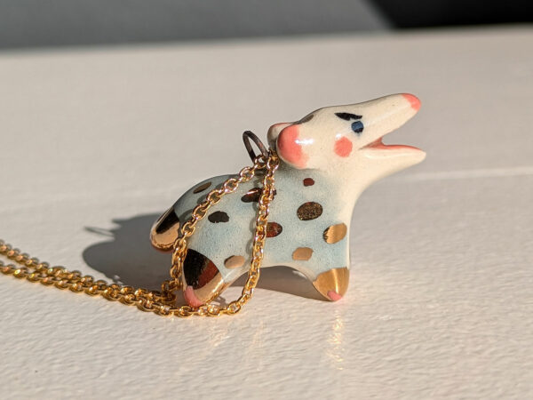 screaming opossum pendant