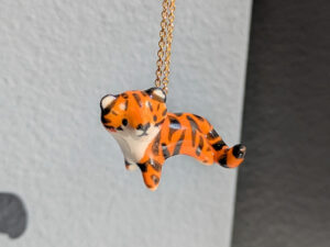 cute handmade porcelain tiger pendant by kness