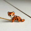 cute handmade porcelain tiger pendant by kness