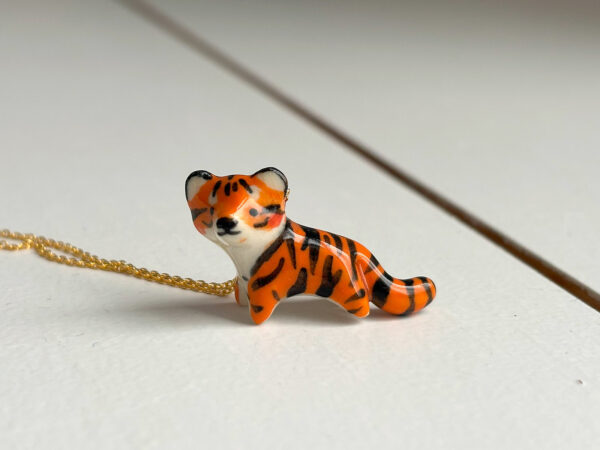 cute handmade porcelain tiger pendant by kness