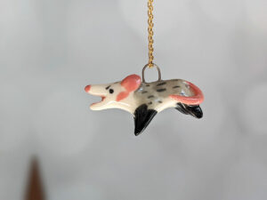screaming opossum pendant