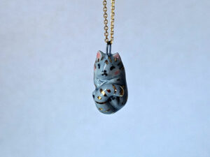 Adorable sleepy cat porcelain pendant