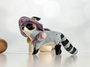 raccoon witch porcelain figurine