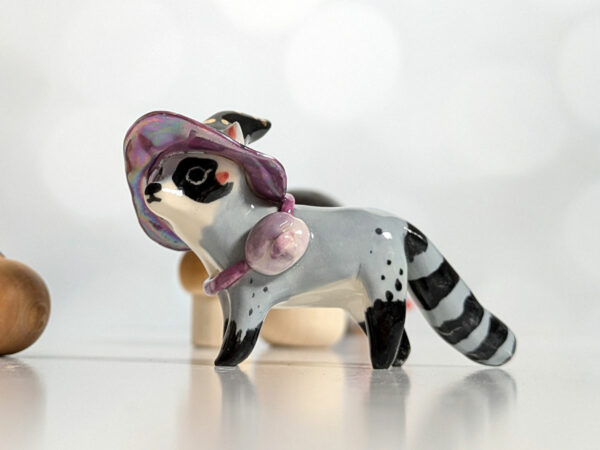 raccoon witch porcelain figurine