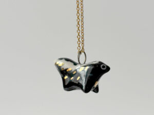 adorable skunk porcelain pendant handmade by kness