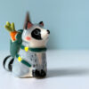 adorable raccoon figurine with a cute backpack porcelain