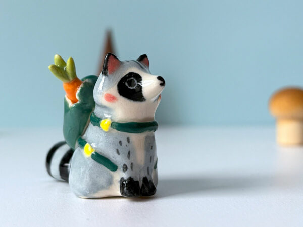 adorable raccoon figurine with a cute backpack porcelain