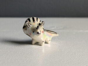 adorable triceratops porcelain pendant