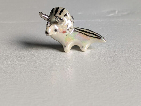 adorable triceratops porcelain pendant