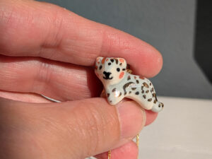 tiny snow leopard pendant