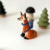 adorable fox figurine with a backpack, handmade porcelain sculpture