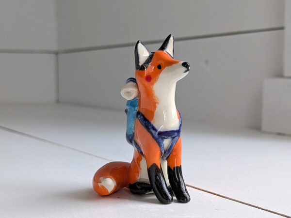 red fox hiker figurine