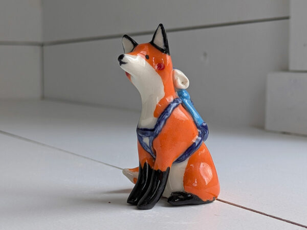 red fox hiker figurine