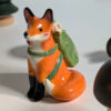 red fox hiker figurine