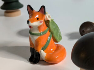 red fox hiker figurine