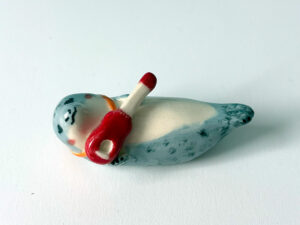 adorable seal playing guitar figurine