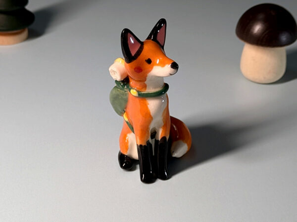 red fox hiker figurine