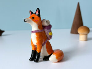 red fox hiker figurine backpack