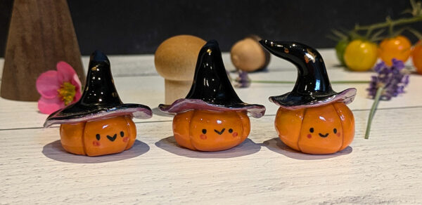 pumpkin witch figurine