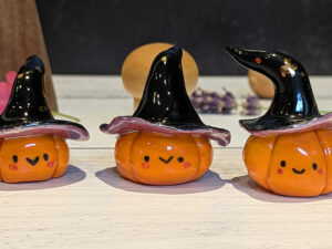 cute pottery by kness pumpkin witch figurine