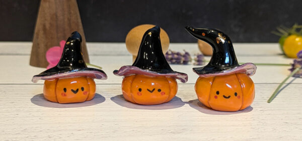 cute pottery by kness pumpkin witch figurine