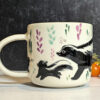 cute mug skunk family