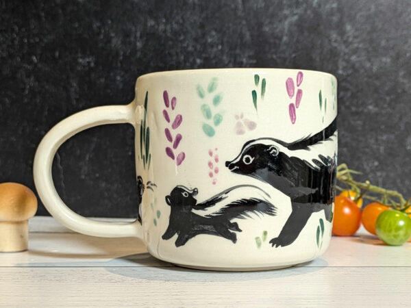 cute mug skunk family