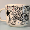 snow leopard tail in mouth mug