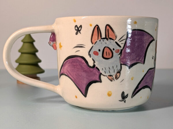 cute little bat mug with a tiny bat sculpted under the handle