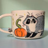 handmade pumpkin and raccoon mug